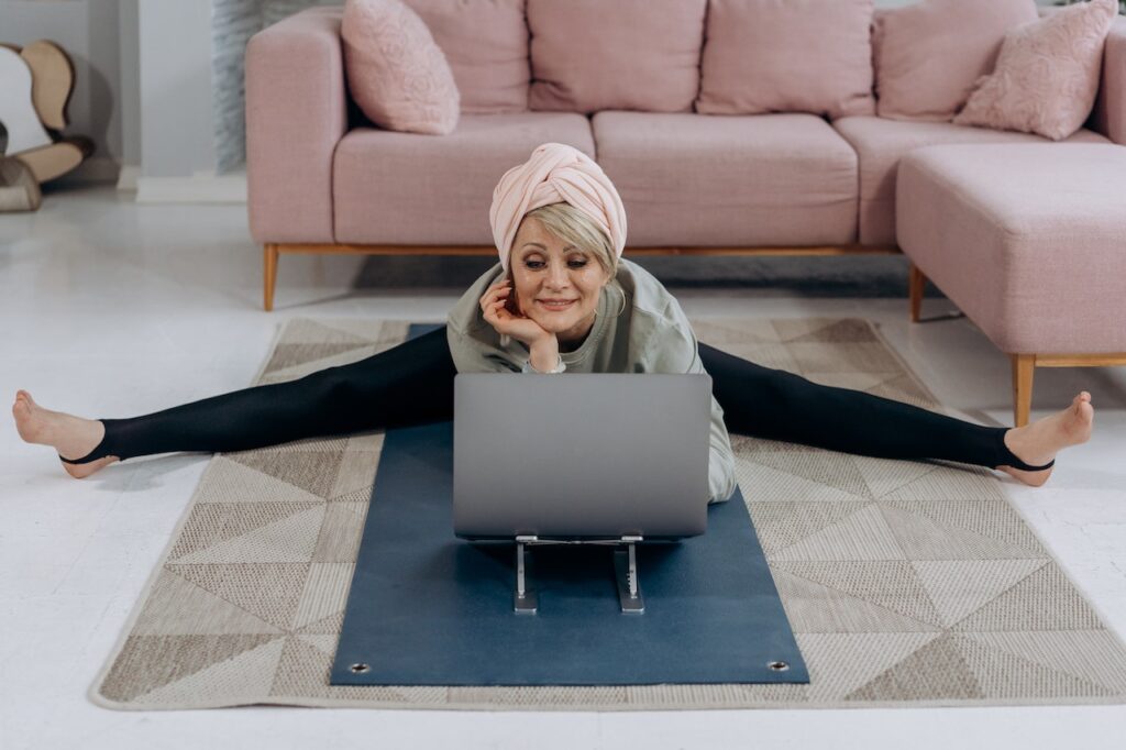 "Seniors participating in a virtual yoga class from the comfort of their own home"