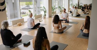 "Group of seniors practicing yoga in a studio"